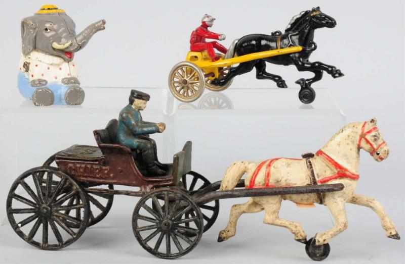 Appraisal: Lot of Cast Iron Horse-Drawn Toys Still Bank American Includes