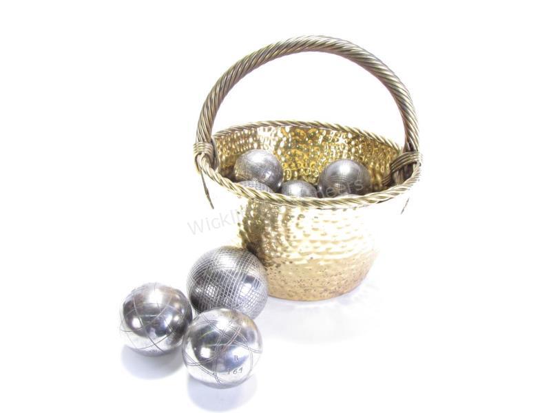 Appraisal: A vintage handled brass basket containing eight various-size Boules balls