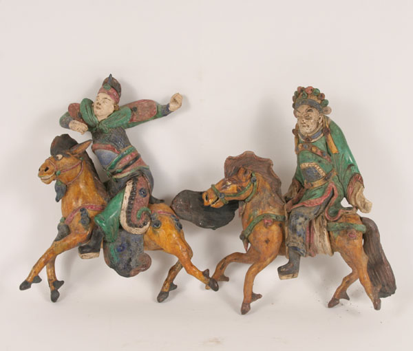 Appraisal: Painted glazed Chinese earthenware mudmen roof tiles female and male