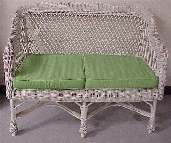 Appraisal: Wicker settee painted white with two green cushions h x