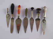 Appraisal: A group of seven silver and white metal trowel page