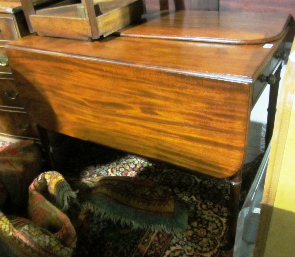 Appraisal: An early th century mahogany Pembroke table with single frieze