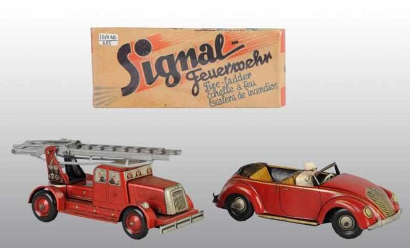 Appraisal: Lot of Tin Vehicle Wind-Up Toys Description German Working Made