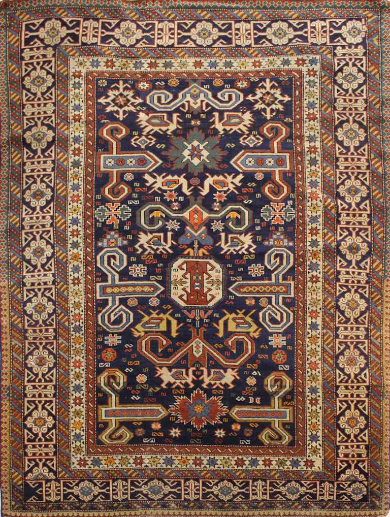 Appraisal: ANTIQUE PERPEDIL CARPET CAUCASUS deep blue field with ivory gold