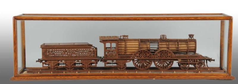 Appraisal: Hand-Carved Fretwork British Outline Loco Tender Description Circa Made of