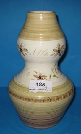 Appraisal: Moorcroft hand thrown natural vase decorated with brown green floral