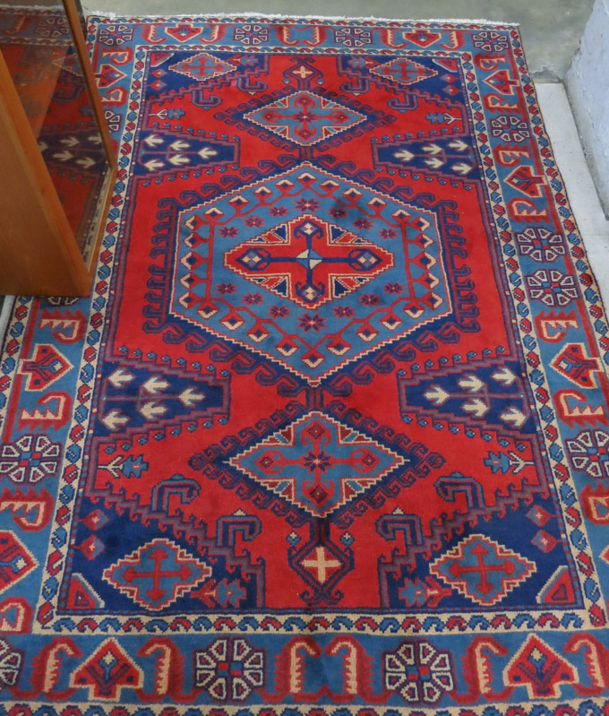 Appraisal: PERSIAN AREA RUG hand knotted in an overall geometric medallion