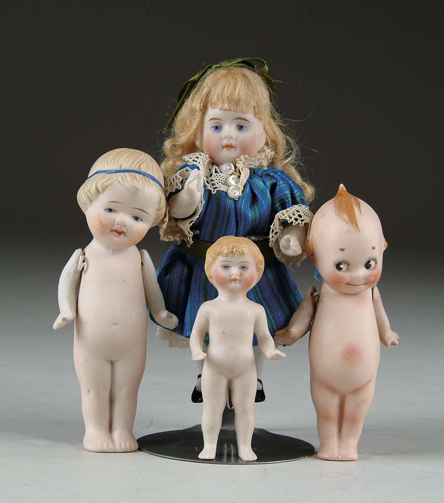 Appraisal: LOT OF FOUR SMALL ALL-BISQUE DOLLS Kewpie doll girl with