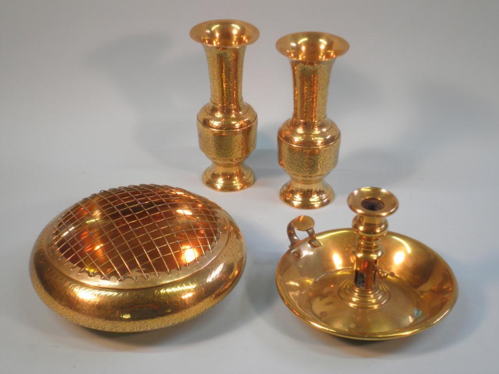 Appraisal: A pair of continental brass vases decorated with leaves similarly