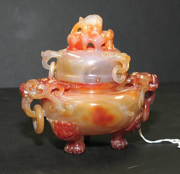 Appraisal: A small carnelian covered censer with dragon finial loose rings