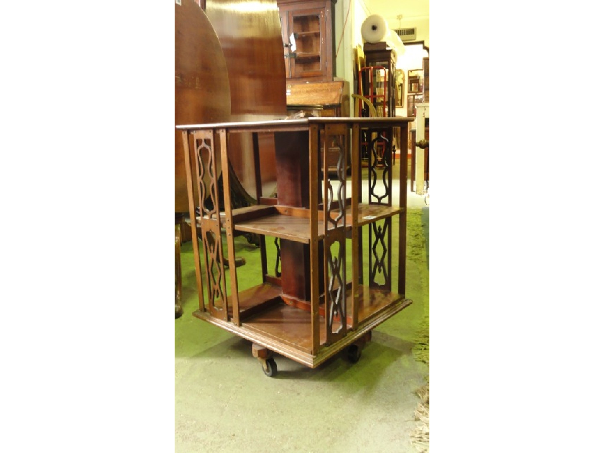 Appraisal: A small inlaid Edwardian mahogany revolving bookcase of square cut