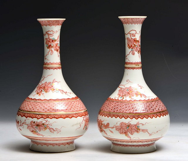 Appraisal: A PAIR OF CHINESE PORCELAIN VASES decorated in coral red