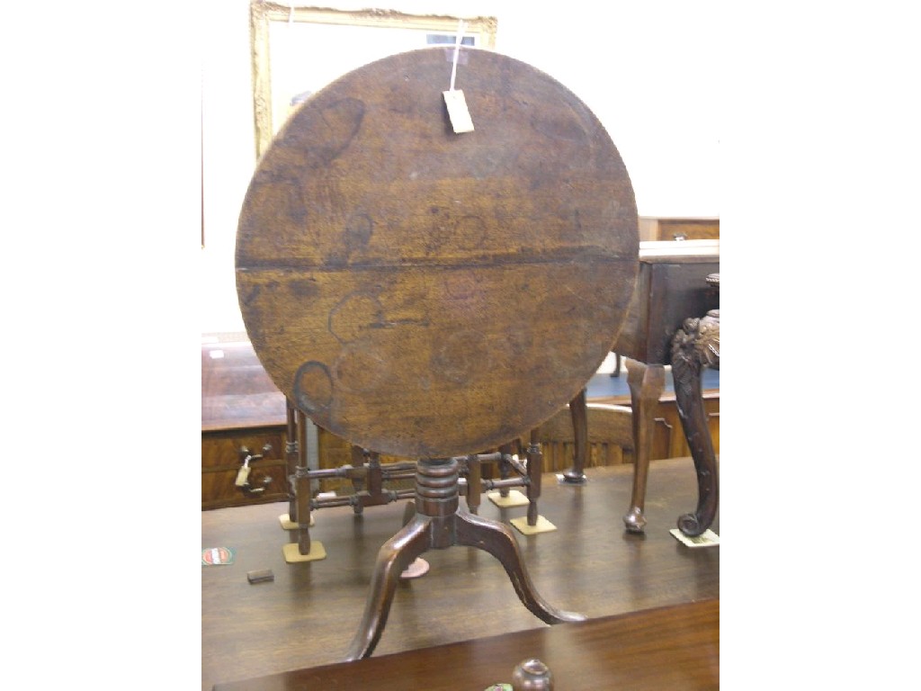 Appraisal: A late Georgian mahogany tripod table circular top tilting upon