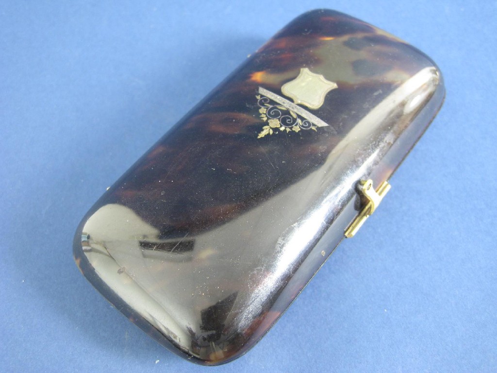 Appraisal: A tortoiseshell Purse with shield cartouche