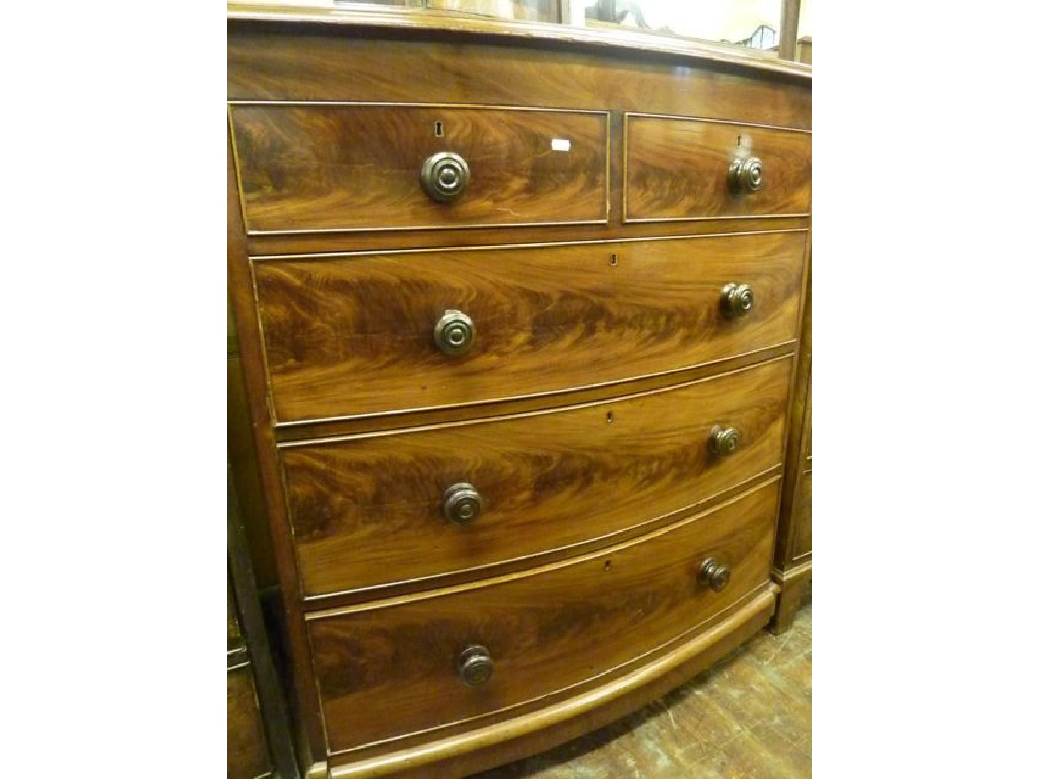 Appraisal: A Victorian mahogany bow fronted chest fitted with three long