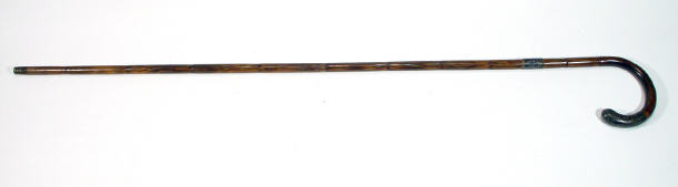 Appraisal: Simulated bamboo walking cane with chased silver collar and grip