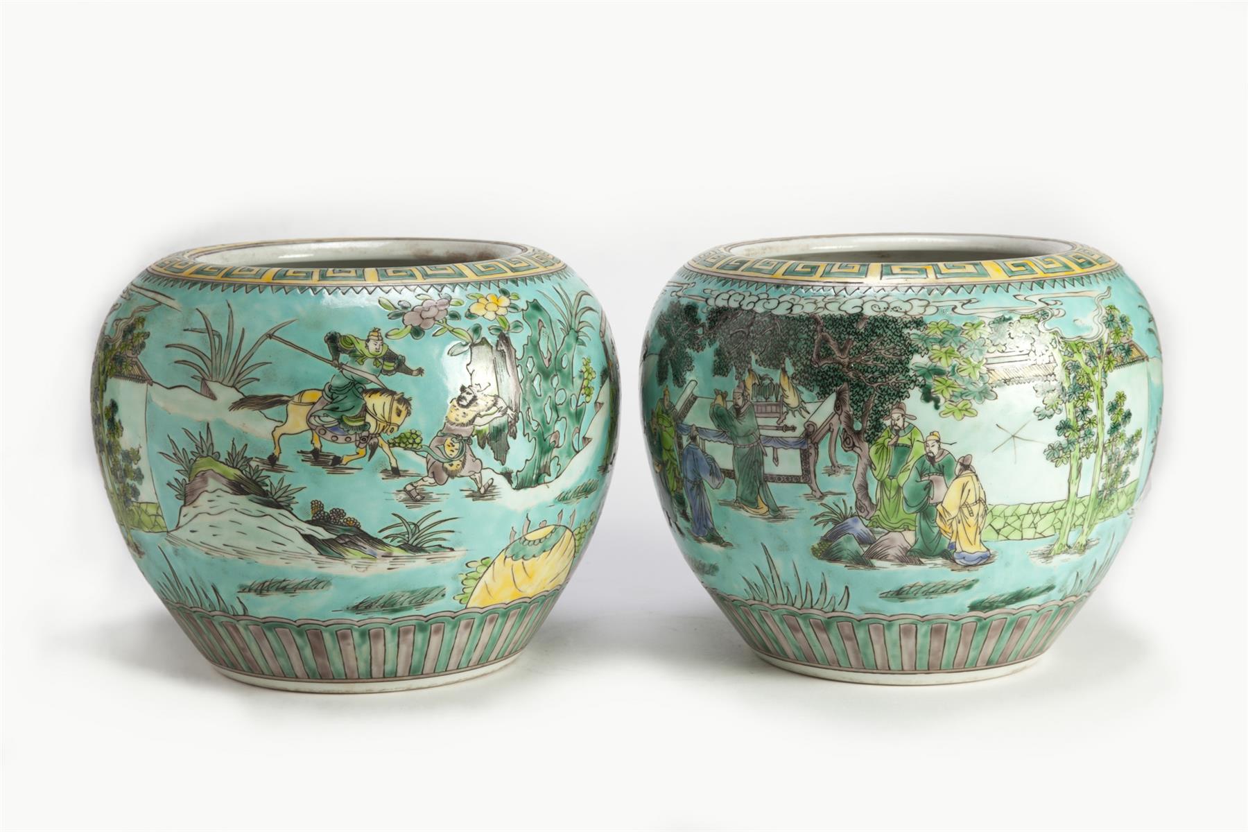 Appraisal: PAIR OF CHINESE PORCELAIN JARDINIERES Twentieth century Polychrome courtiers in