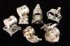 Appraisal: FIGURAL SILVER PLATE NAPKIN RINGS - Including ring supported by