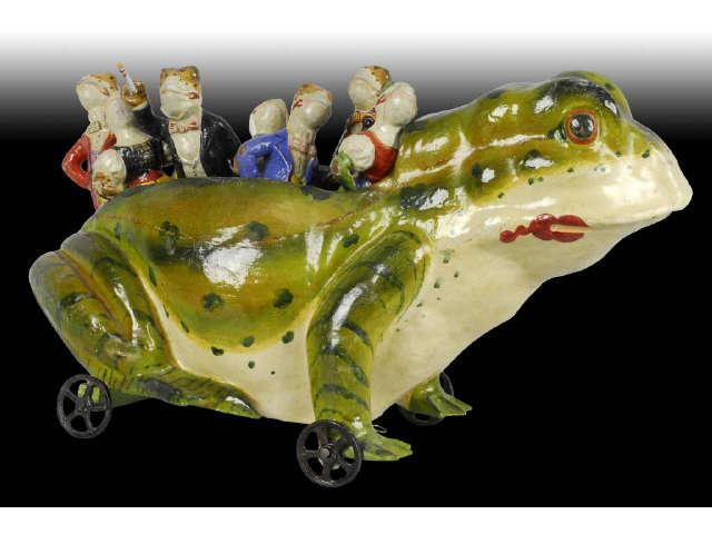 Appraisal: German Paper Mache Frog Skittles Set Description Seven small dressed