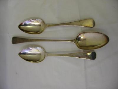 Appraisal: A GEORGE III BASTING SPOON London long and a pair