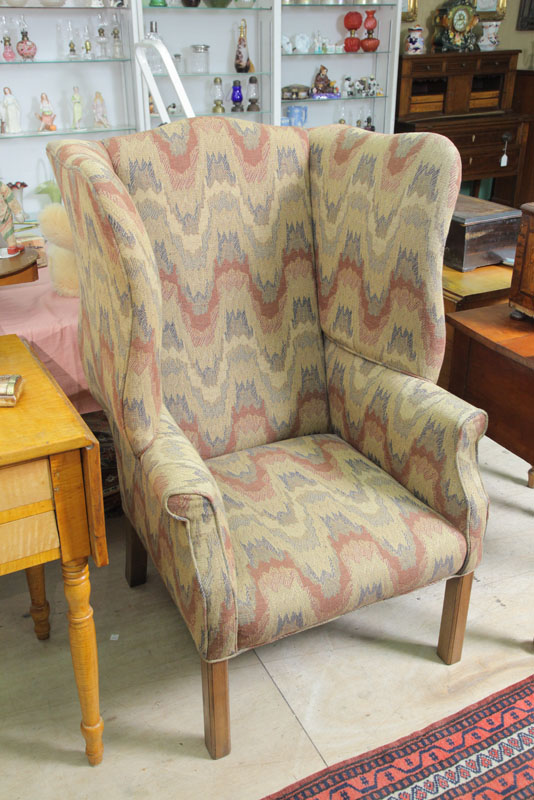 Appraisal: WINGBACK CHAIR Blue red and cream flame upholstery on square