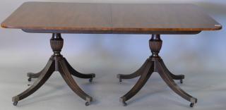 Appraisal: Baker mahogany dining table with double pedestal base and three