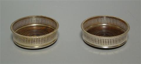 Appraisal: PAIR OF ENGLISH PLATED WINE COASTER With pierced sides and