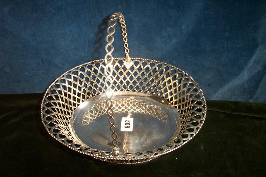 Appraisal: A silver basket of oval form with profuse pierced decoration