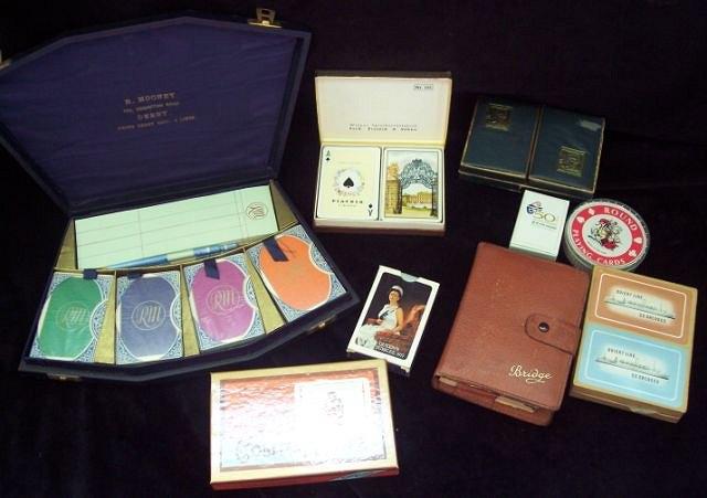 Appraisal: A cased set of cards comprising four packs bridge pencils