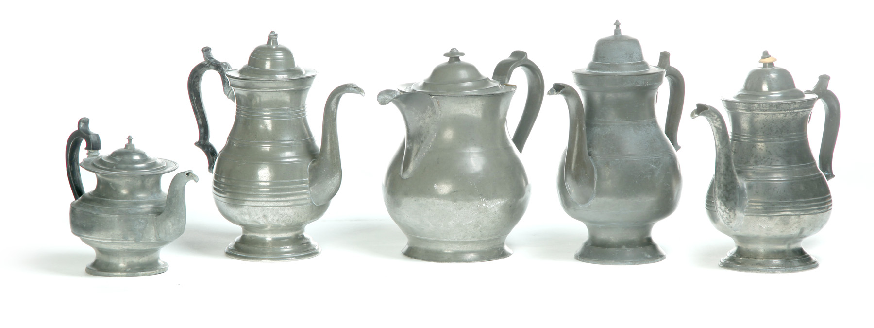 Appraisal: FIVE AMERICAN PEWTER POTS Three coffee pots h to h