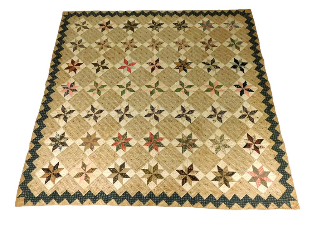 Appraisal: TEXTILE Pieced cotton calico quilt in an eight-pointed star LeMoyne