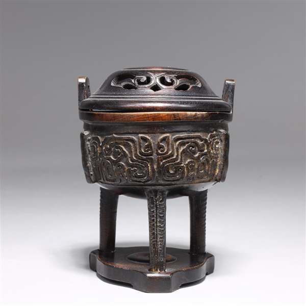 Appraisal: Chinese bronze tripod incense censer with wood lid and base