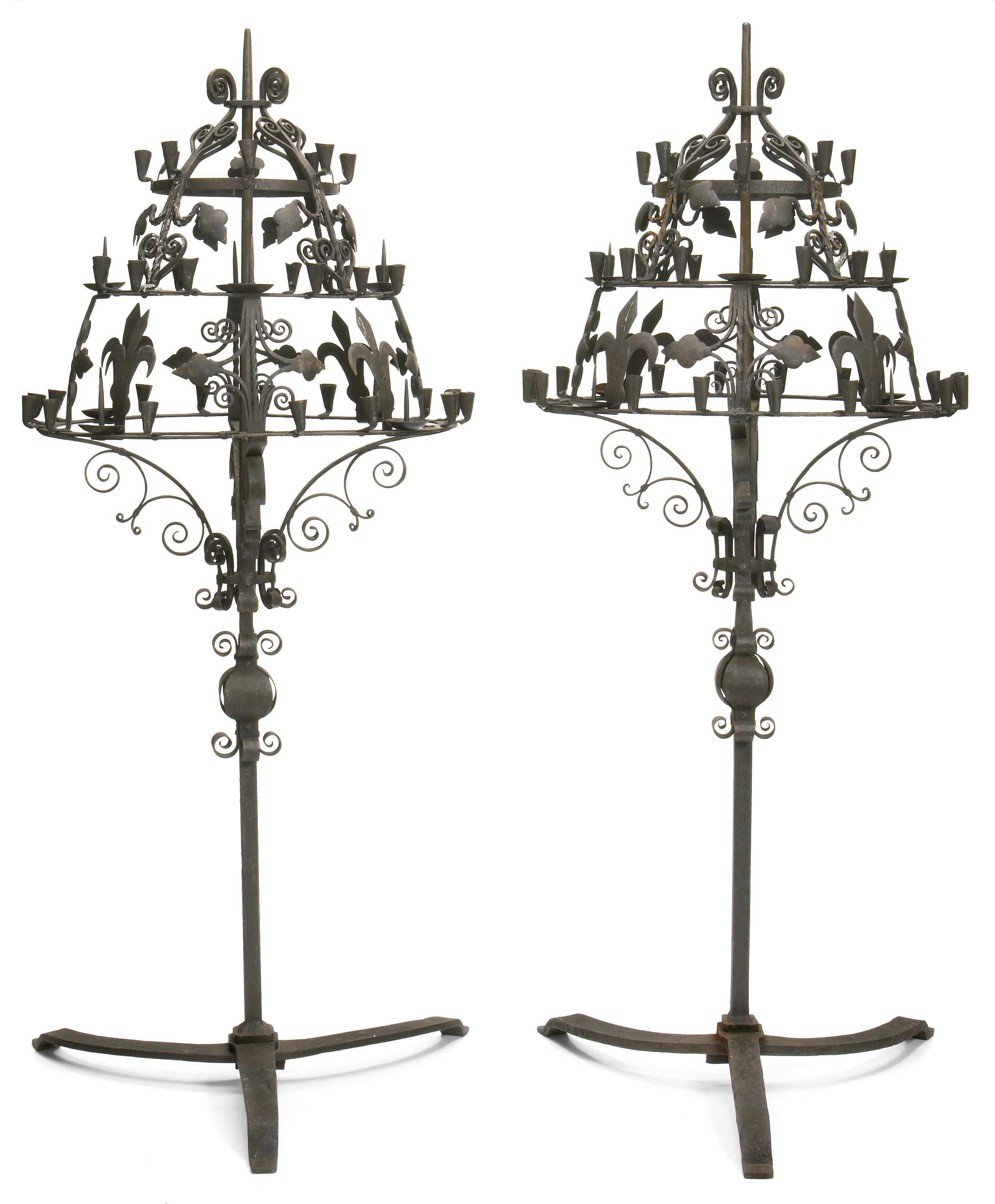 Appraisal: A pair of Spanish Baroque style wrought iron floor lamps