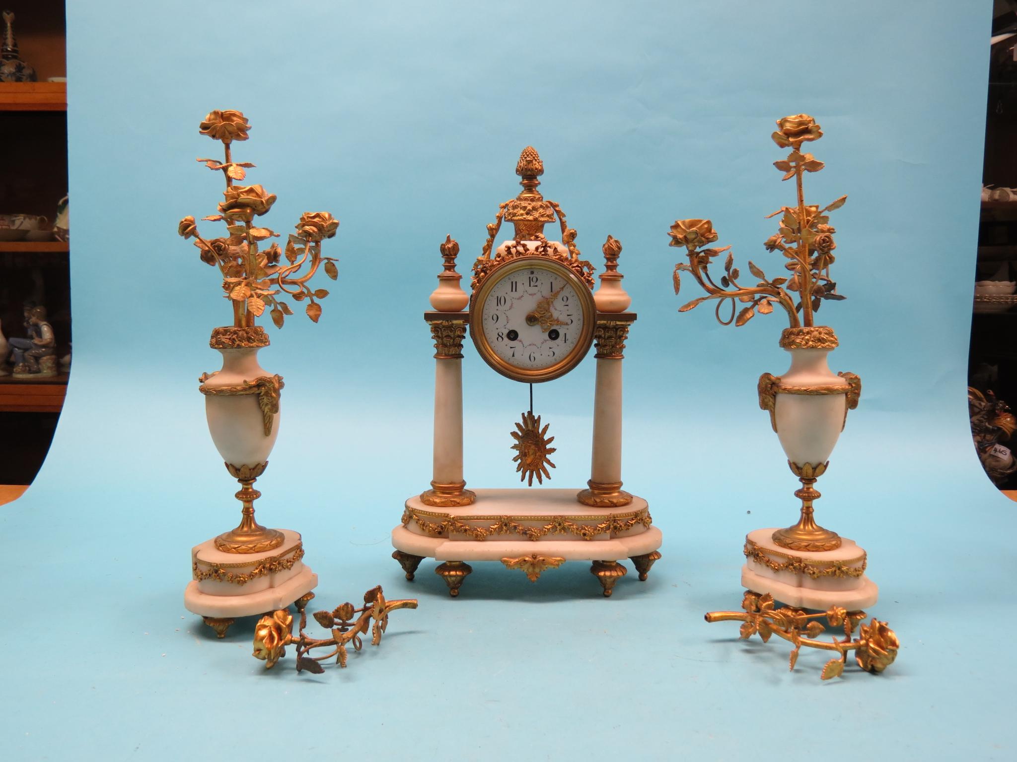 Appraisal: A th century French alabaster and ormolu clock garniture clock