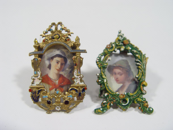 Appraisal: Two miniature gilt brass easel photo frames with enamelled decoration