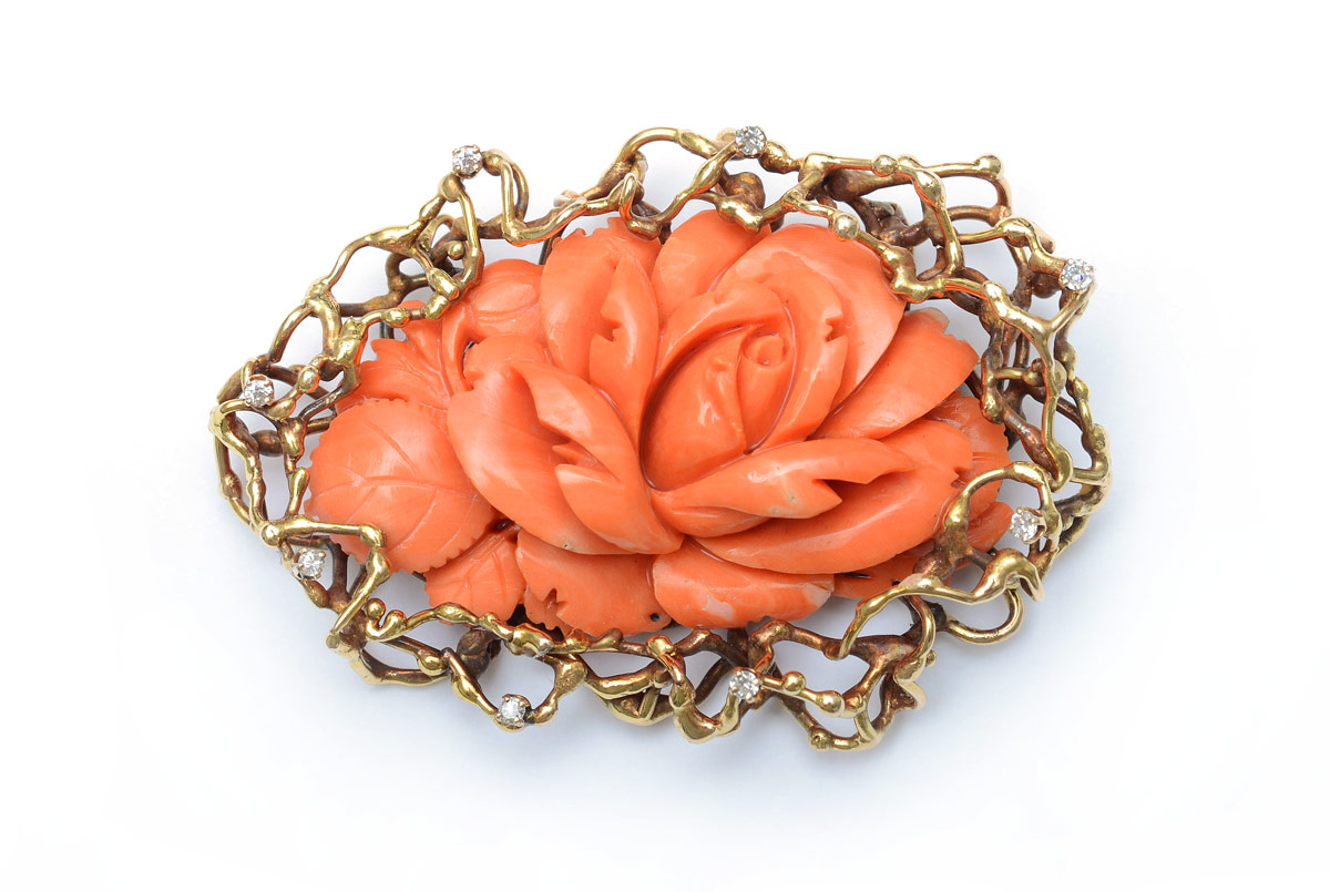 Appraisal: CARVED CORAL AND DIAMOND BROOCH Large floral carved salmon color