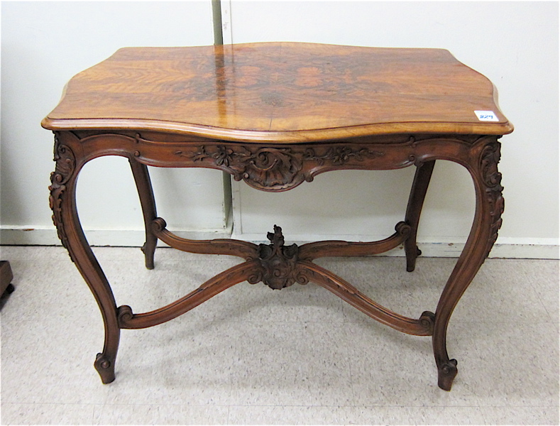 Appraisal: LOUIS XV STYLE CARVED WALNUT CENTER TABLE French early th