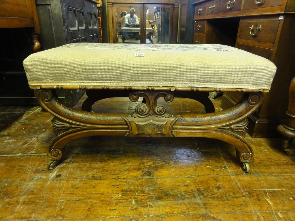 Appraisal: A Victorian walnut centre stool of rectangular form with floral