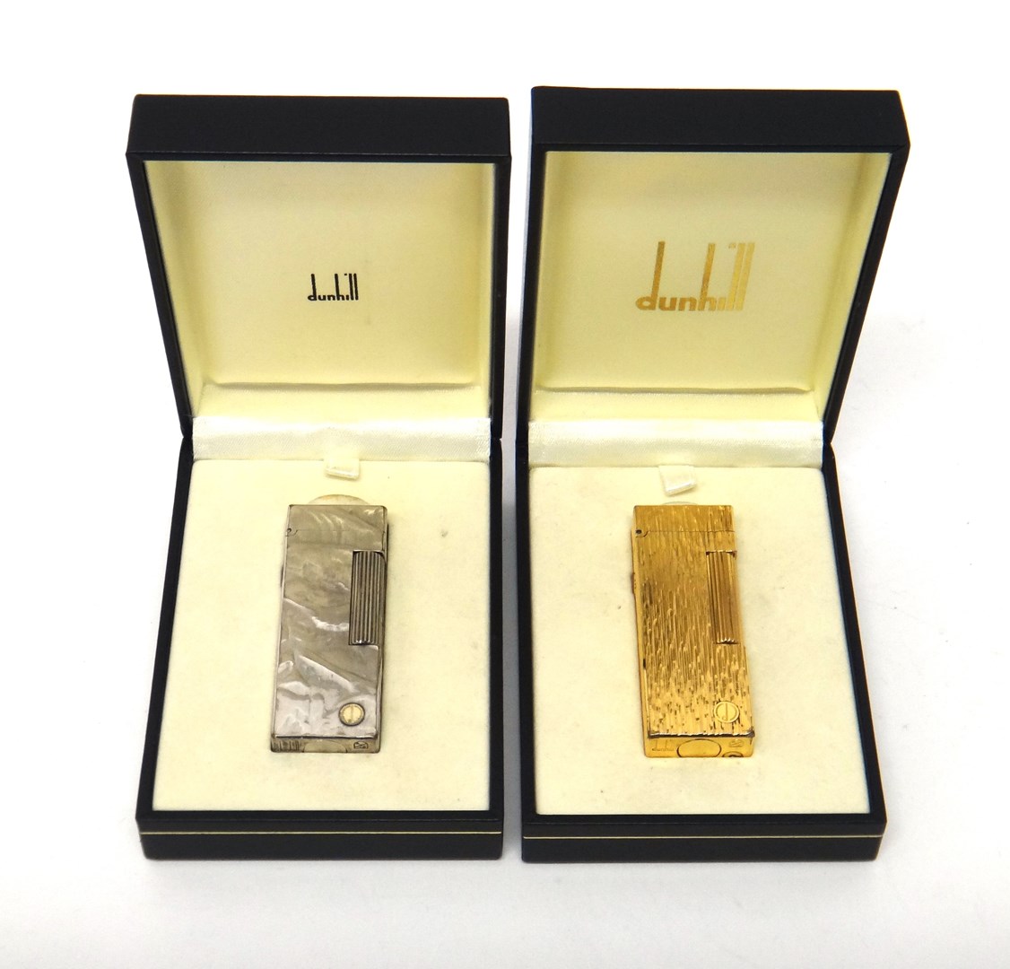 Appraisal: A gold plated Dunhill rectangular gas lighter with bark textured