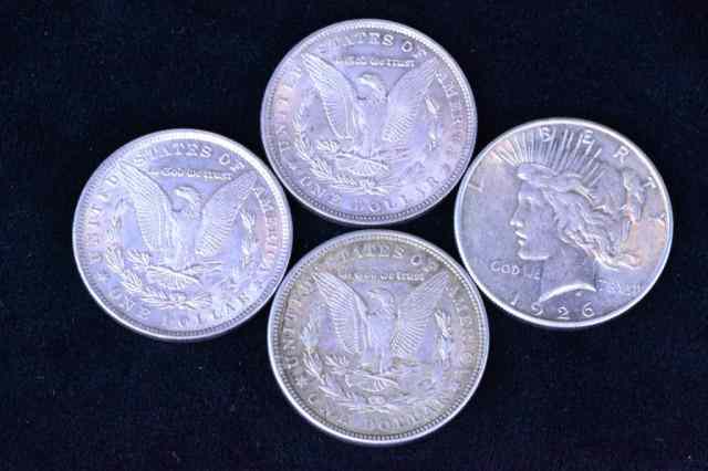 Appraisal: MORGAN AND LIBERTY SILVER DOLLARSIncluding three Morgan silver dollars with