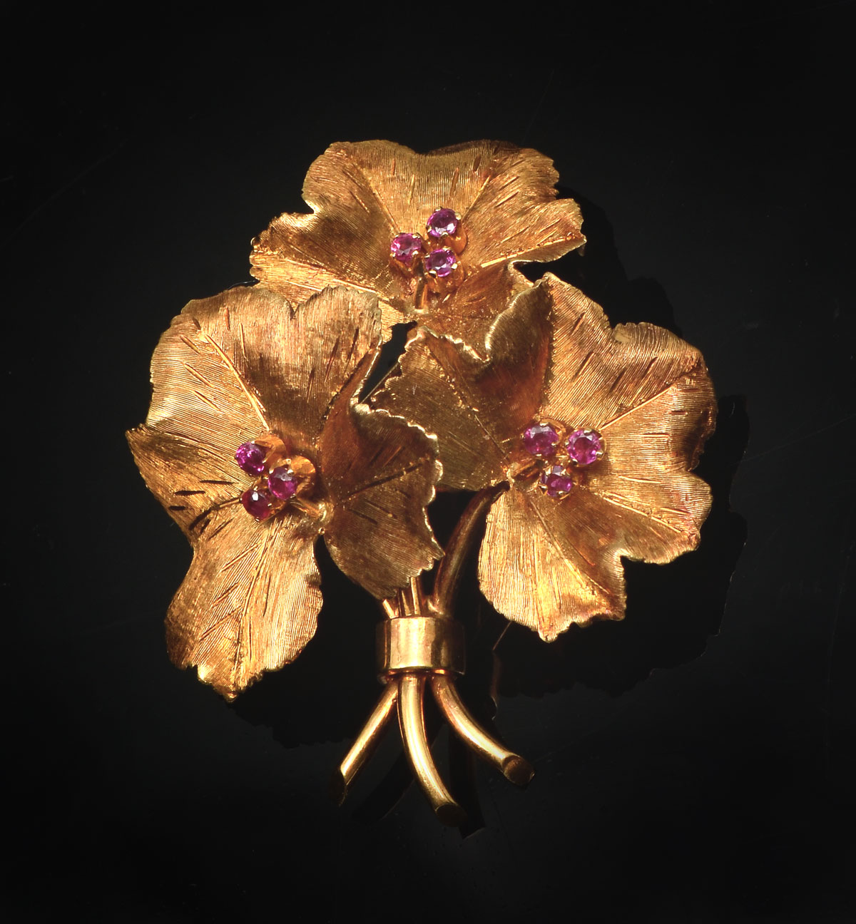 Appraisal: K TIFFANY FLOWER RUBY BROOCH K yellow gold brooch contains