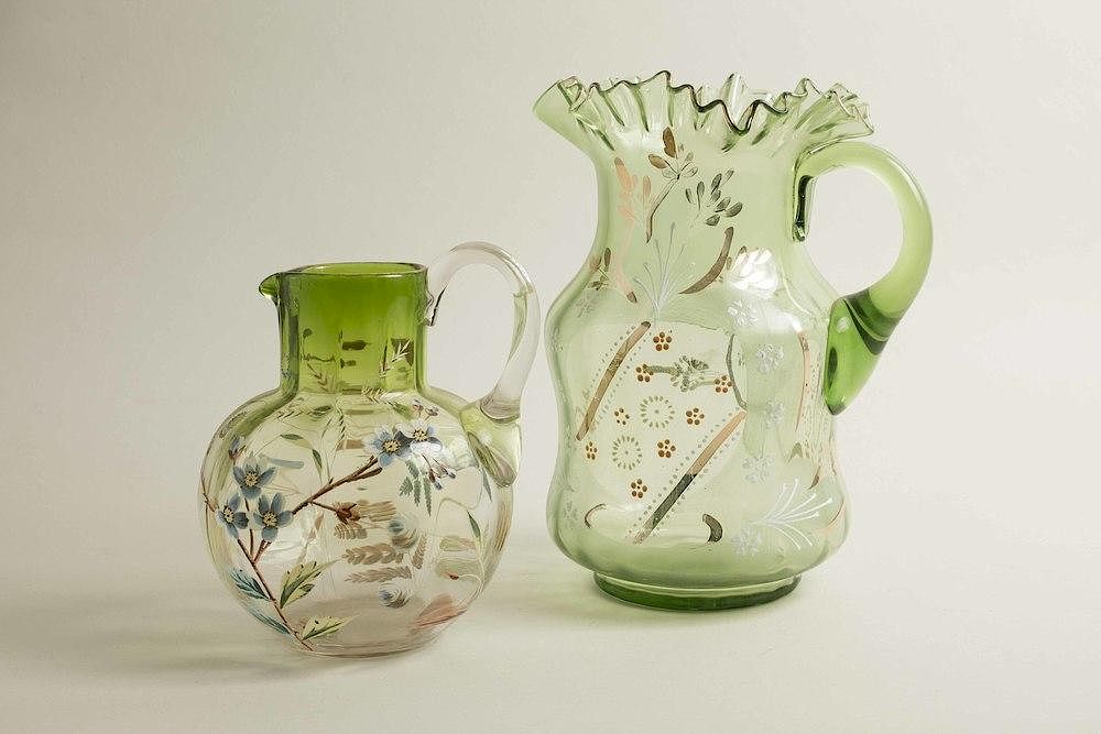 Appraisal: Two Enameled Glass Pitchers Two enameled green glass pitchers Dimension