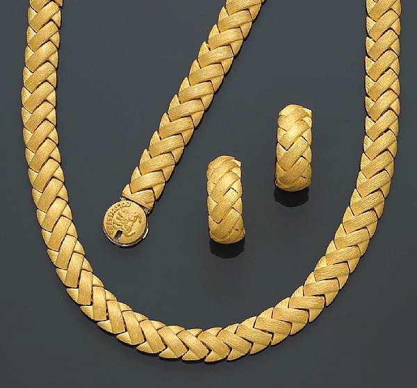 Appraisal: A suite of twenty-four karat gold jewelry of braided motif