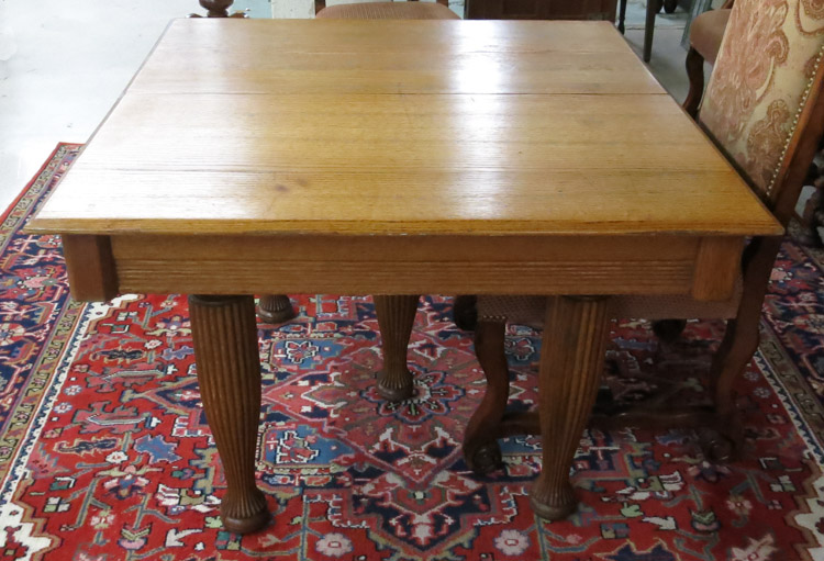 Appraisal: SQUARE OAK DINING TABLE American c standing on five reeded