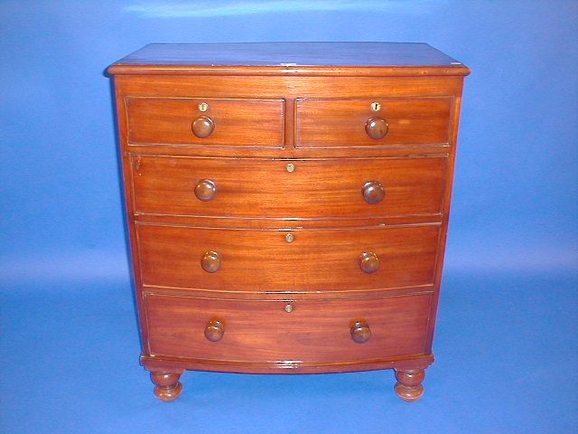 Appraisal: A Victorian mahogany bow front chest of two short and