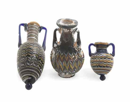 Appraisal: Three Roman Glass Bottles each of handled form with polychrome