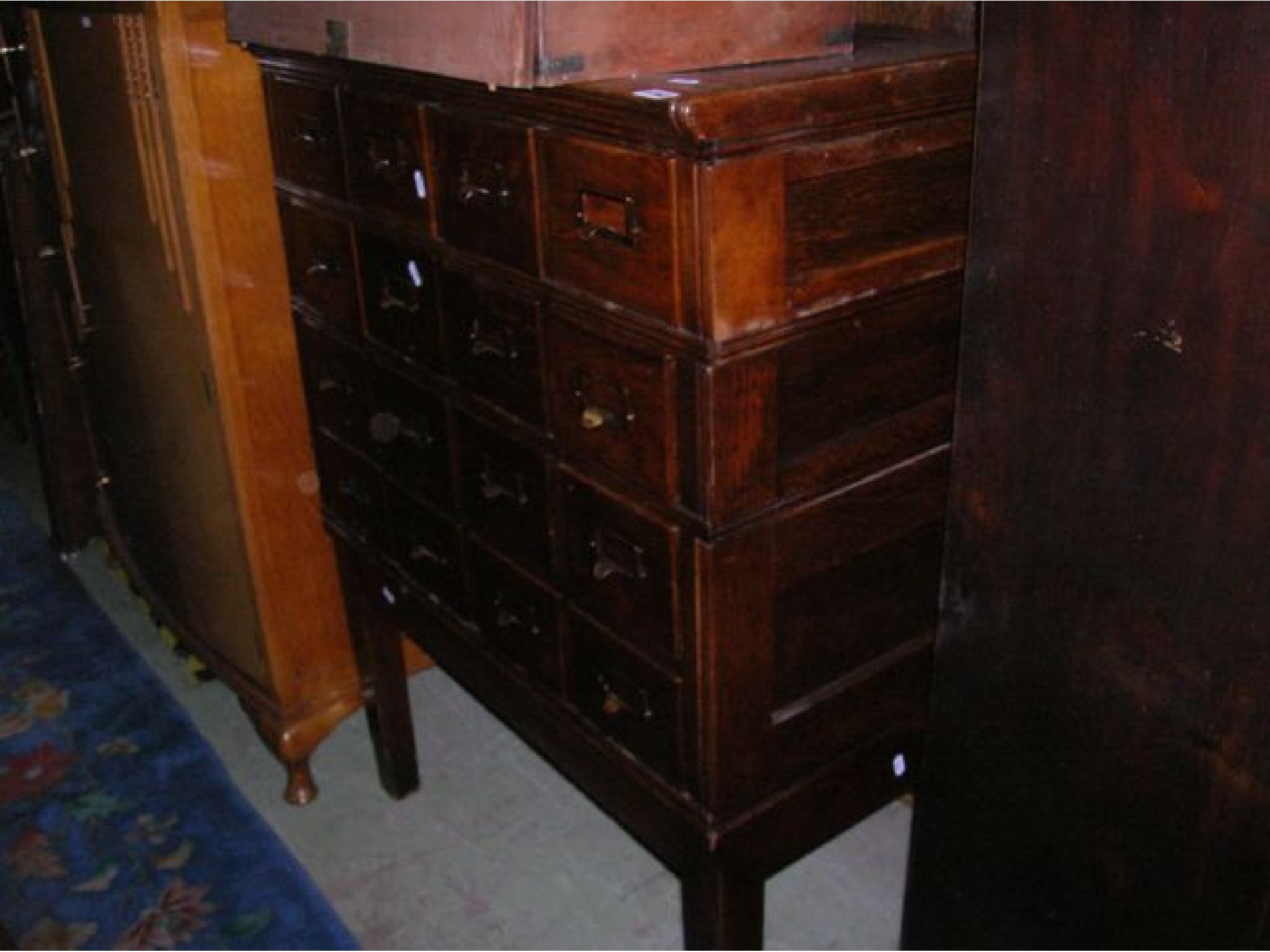 Appraisal: An Edwardian index filing chest of sixteen small drawers in