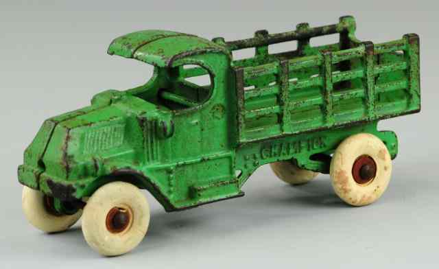 Appraisal: CHAMPION MACK STAKE TRUCK Cast iron painted in green overall