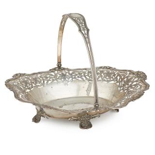 Appraisal: STERLING SILVER SWING ARM FOOTED BASKET Hand-pierced and open floral