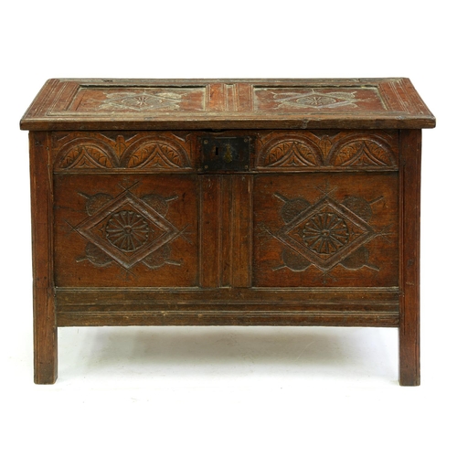 Appraisal: A Charles II oak chest with twin panel lid and